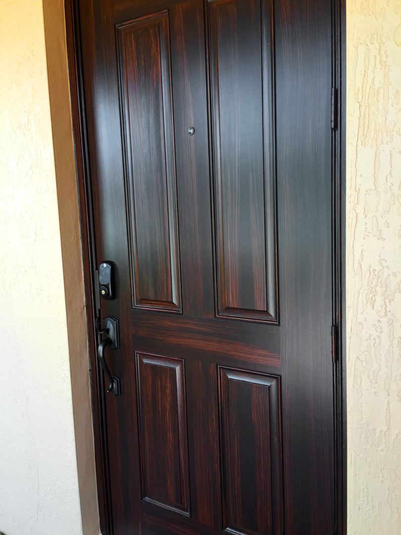 Dark mahogany finish on paneled entry door