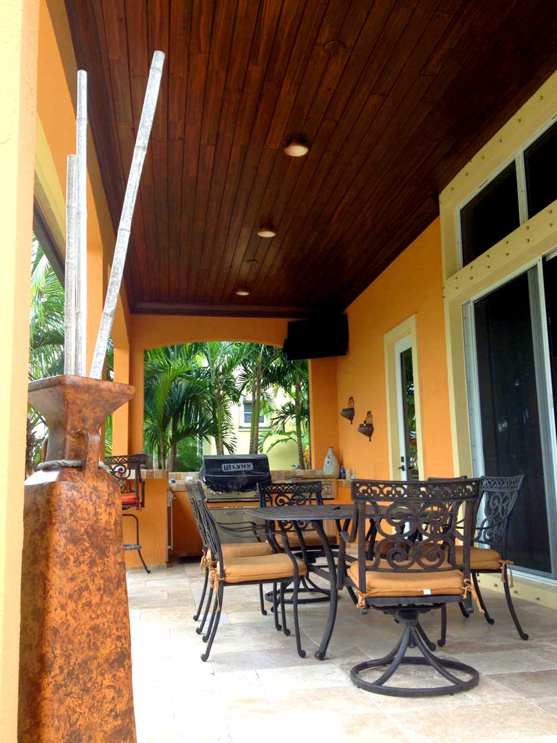 Faux walnut finish on outdoor patio ceiling