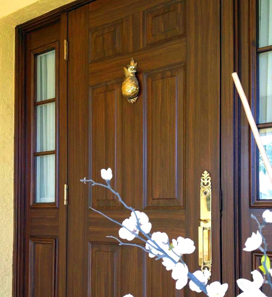 Faux walnut finish on entry door with sidelights